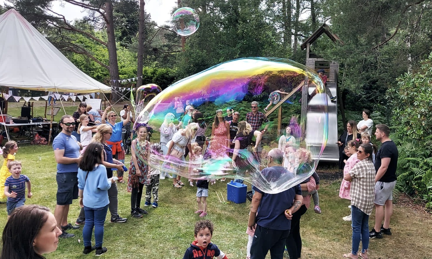group of people enjoying our summer festival with giant bubble